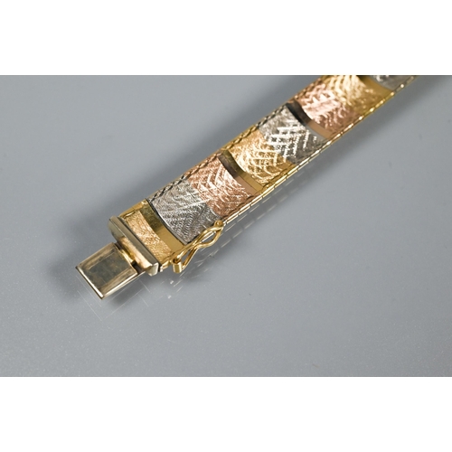 293 - A modern tri-coloured bracelet formed of etched rectangular links of yellow, white and rose metal, c... 