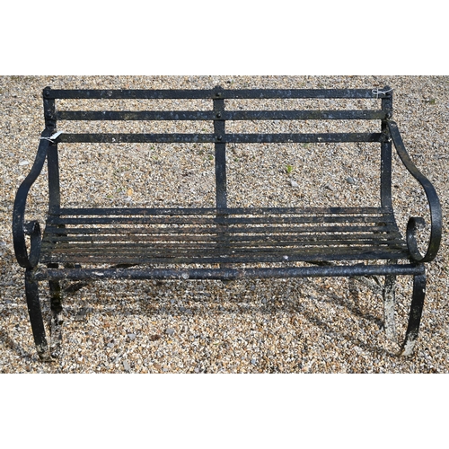 900 - An antique black-painted wrought iron strap-work bench, 124 cm wide