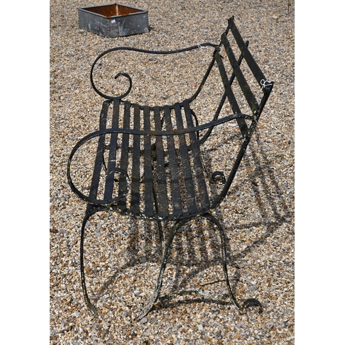 900 - An antique black-painted wrought iron strap-work bench, 124 cm wide