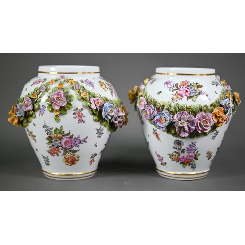 575 - A good pair of German porcelain vases, the domed covers surmounted by an 18th century lady and gentl... 