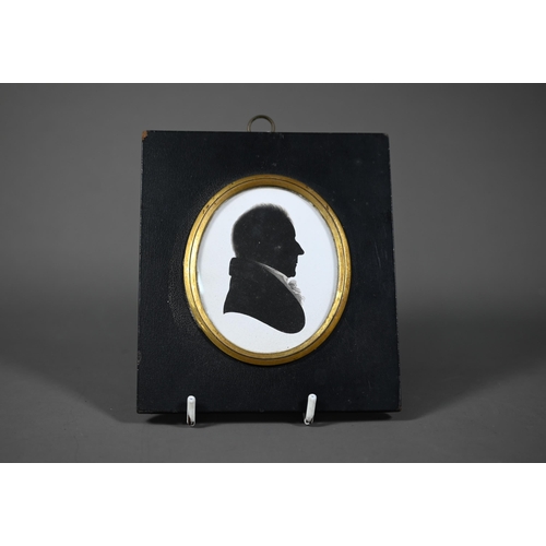 1107 - A Regency silhouette of a gentleman, by Miers & Field, 111 The Strand, London, 8 x 6.5 cm, in eb... 