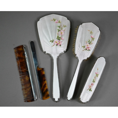 101 - A basse-taille and floral enamelled silver four-piece brush set including hand-mirror and comb (latt... 