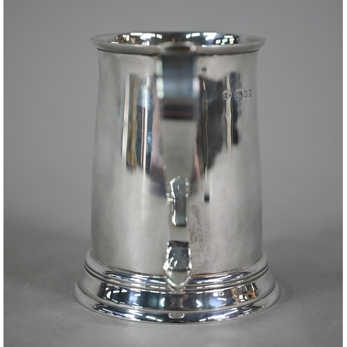 103 - A silver half-pint mug in the Georgian manner, with scroll handle and moulded foot-rim, Blackmore &a... 