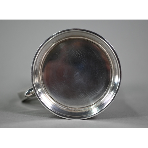 103 - A silver half-pint mug in the Georgian manner, with scroll handle and moulded foot-rim, Blackmore &a... 