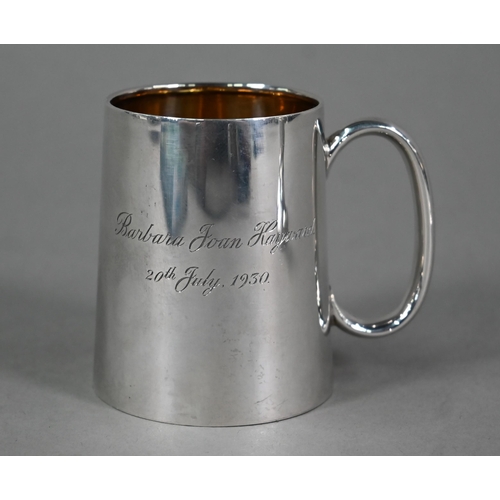 104 - A small silver Christening mug of plain tapering form, Birmingham 1926, to/w a pair of George III fe... 