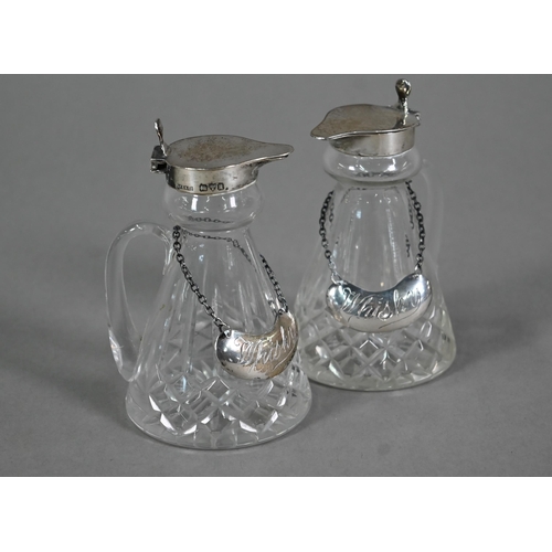 107 - A pair of cut glass conical whisky noggins with silver tops and engraved labels, S. Blackensee &... 