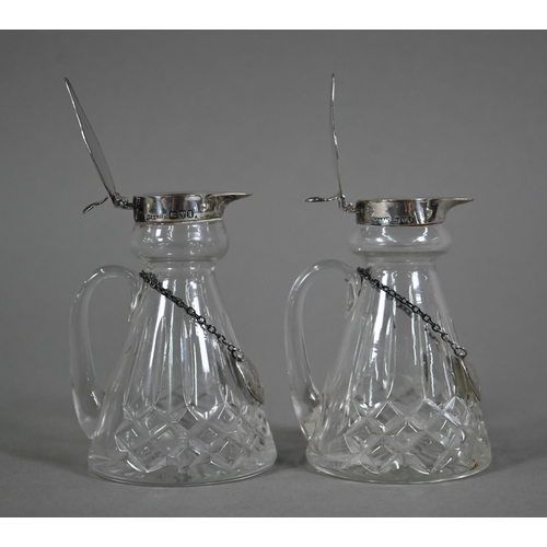 107 - A pair of cut glass conical whisky noggins with silver tops and engraved labels, S. Blackensee &... 