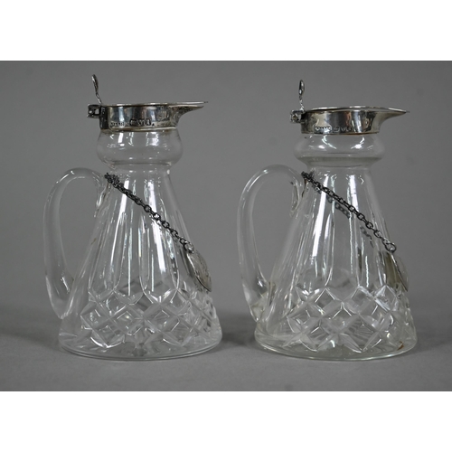 107 - A pair of cut glass conical whisky noggins with silver tops and engraved labels, S. Blackensee &... 