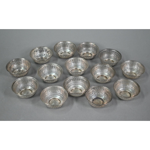 110A - A set of fourteen US Sterling small pierced bowls, 6.5cm diameter, 9.6oz