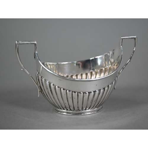 114 - An Edwardian half-reeded sugar basin with twin handles, Mappin & Webb, Sheffield 1905, a George ... 