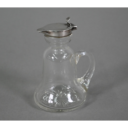 116 - A glass whisky noggin of bell-form with drawn handle and star-cut base, hinged silver top by Hukin &... 