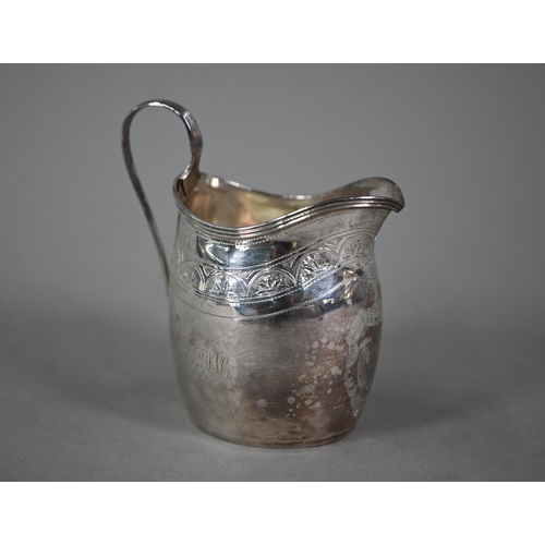 119 - A George III silver cream jug with reeded rim and strap handle and engraved decoration, Peter & ... 