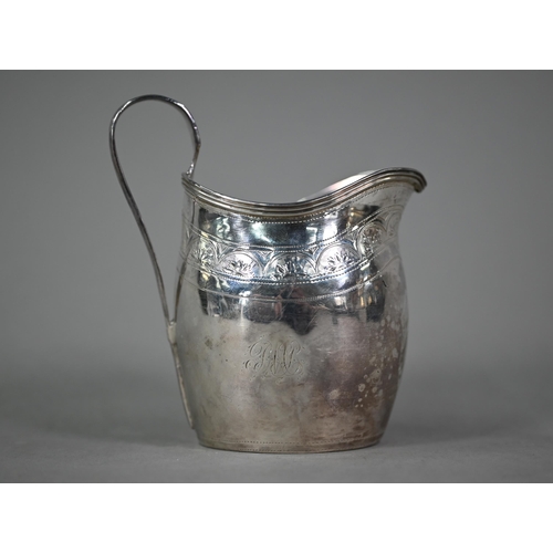 119 - A George III silver cream jug with reeded rim and strap handle and engraved decoration, Peter & ... 