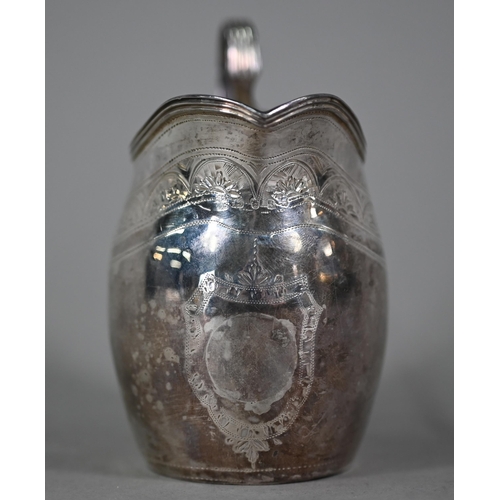 119 - A George III silver cream jug with reeded rim and strap handle and engraved decoration, Peter & ... 