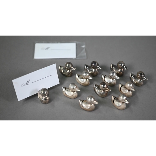 13 - A set of twelve electroplated novelty placecard-holders, modelled as rubber ducks, to/w a set of thr... 