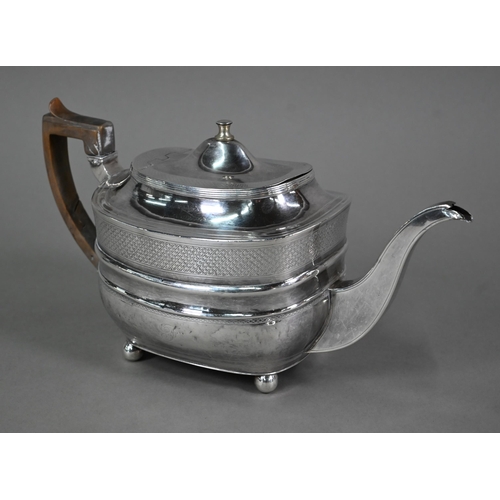 130 - A Regency silver teapot of oblong form  with diaper engraving and horn handle, on ball feet, Thomas ... 