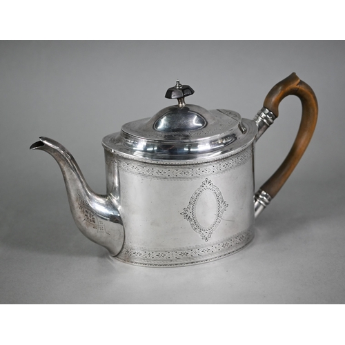 132 - An Edwardian Sheraton revival oval silver teapot with engraved decoration and wooden handle and fini... 