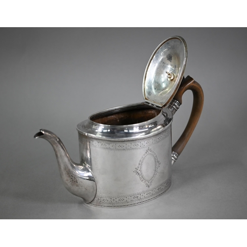 132 - An Edwardian Sheraton revival oval silver teapot with engraved decoration and wooden handle and fini... 