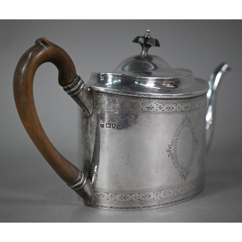 132 - An Edwardian Sheraton revival oval silver teapot with engraved decoration and wooden handle and fini... 