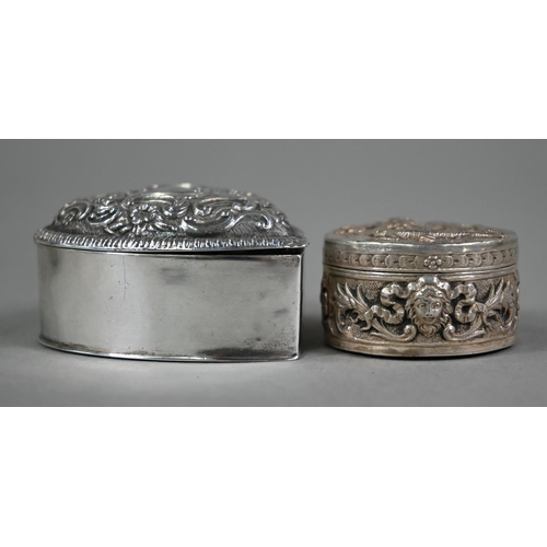 138 - An Edwardian circular silver small box, the cover finely embossed and chased with a cat hunting a li... 