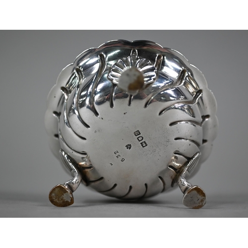 142 - An Edwardian heavy quality silver bonbon dish with writhen fluting, on three shell and hoof supports... 