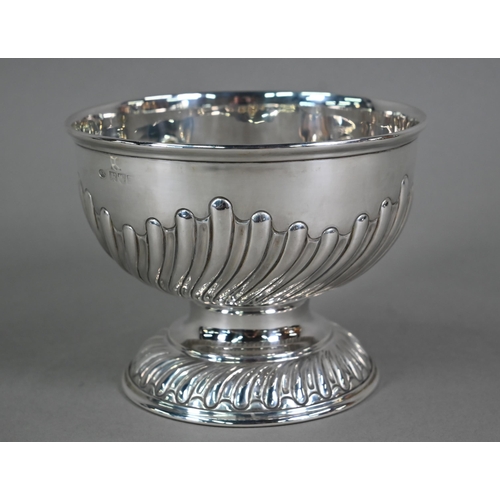 151 - A late Victorian heavy quality silver rose bowl with writhen half-reeding, on stemmed foot, William ... 