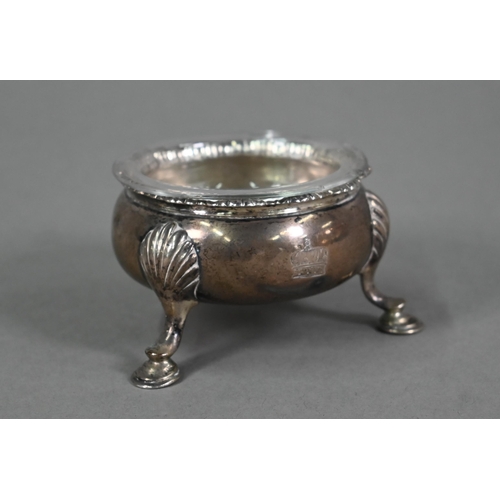 152 - A George II silver circular salt with moulded rim and three shell and hoof feet, Edward Wood, London... 