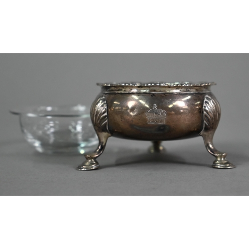 152 - A George II silver circular salt with moulded rim and three shell and hoof feet, Edward Wood, London... 