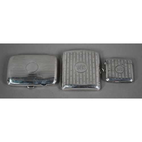 153 - An engraved silver cigarette case with matching vesta case, Walker & Hall , Sheffield/Chester 19... 