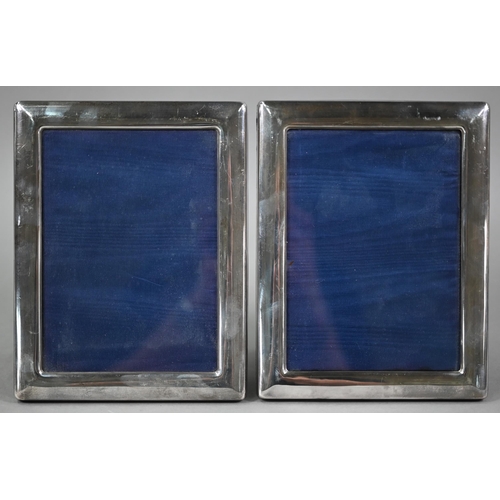 164 - A pair of silver-mounted photograph frames, Carr's, Sheffield 1998, 22 x 17.5cm