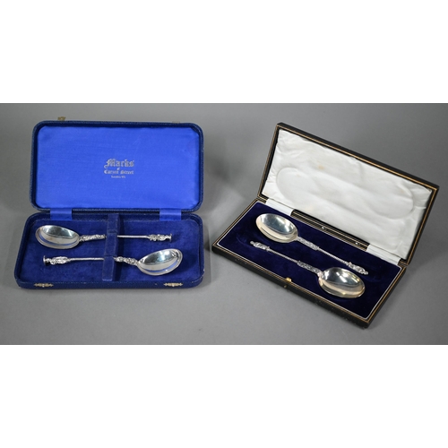 166 - A cased set of two berry spoons with matching sifter ladle, all of Georgian origin, with gilt bowls,... 