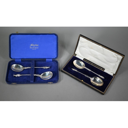 166 - A cased set of two berry spoons with matching sifter ladle, all of Georgian origin, with gilt bowls,... 