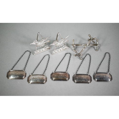 170 - A pair of late Victorian silver menu-holders modelled as doves with olive branches (probably a famil... 