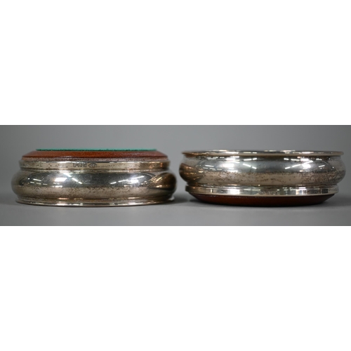 172 - A pair of silver champagne bottle-coasters with turned wood bases, W.I Broadway & Co, Birmingham... 