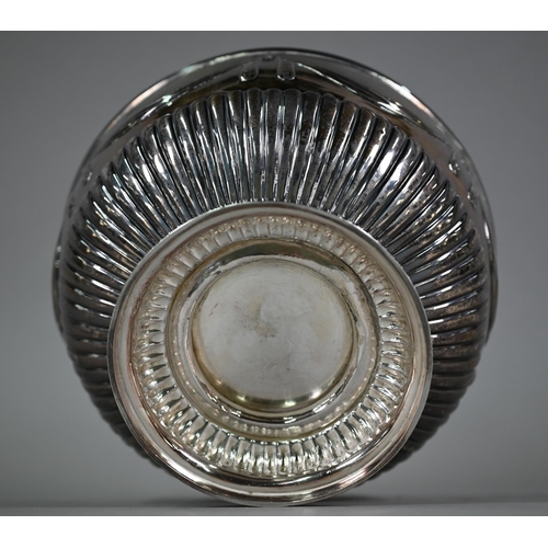 174 - A Victorian silver rose-bowl embossed with ribbon swags and half reeding, on stemmed foot, Charles S... 