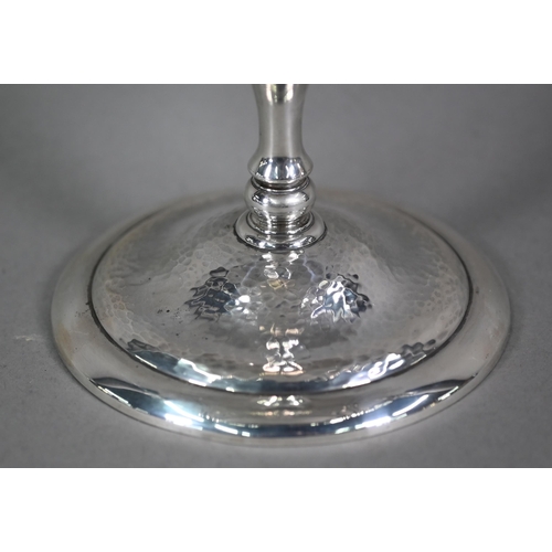 184 - An Edwardian silver comport in the Arts and Crafts manner, with twin scroll handles and part-planish... 