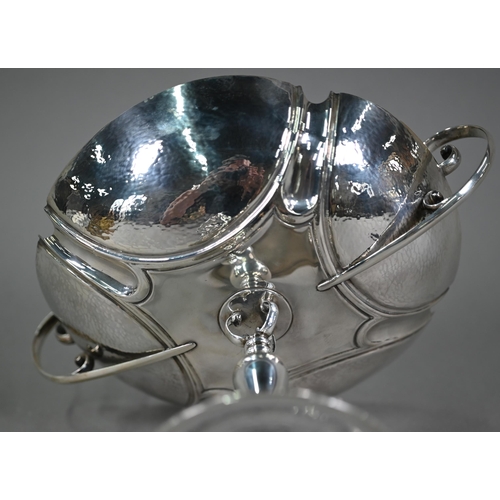 184 - An Edwardian silver comport in the Arts and Crafts manner, with twin scroll handles and part-planish... 