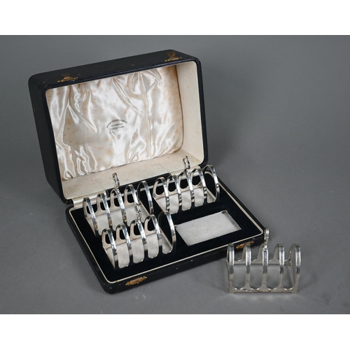 187 - A cased set of four silver toast racks, Adie Brothers Ltd, Birmingham 1934, 8.6oz