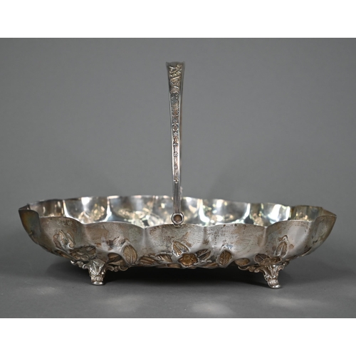 194 - An Edwardian silver basket with swing loop handle, richly embossed and chased with flowers, foliage ... 