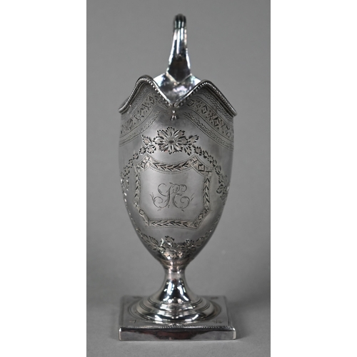 195 - A George III silver urn-shaped cream jug in the Adam manner, with beaded rim, engraved decoration an... 