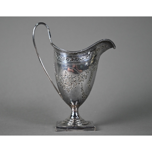 195 - A George III silver urn-shaped cream jug in the Adam manner, with beaded rim, engraved decoration an... 