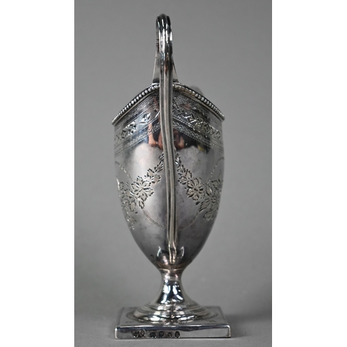 195 - A George III silver urn-shaped cream jug in the Adam manner, with beaded rim, engraved decoration an... 