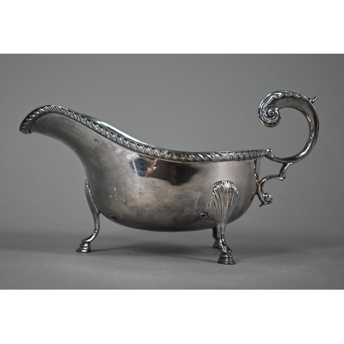 196 - A US market (Tiffany) Irish silver sauce-boat in Georgian taste, with gadrooned rim, scroll handle a... 