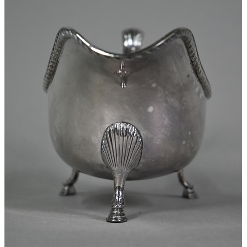 196 - A US market (Tiffany) Irish silver sauce-boat in Georgian taste, with gadrooned rim, scroll handle a... 