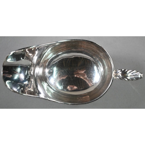 196 - A US market (Tiffany) Irish silver sauce-boat in Georgian taste, with gadrooned rim, scroll handle a... 