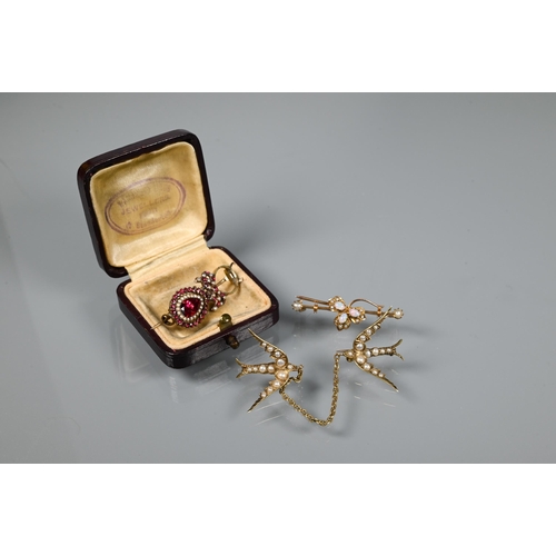 204 - Two seed pearl set brooches modelled as swallows in flight, linked with chain, yellow metal set; a s... 