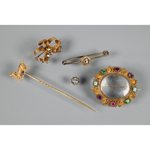 206 - A Victorian gilt metal oval brooch with filigree decoration and set with semi-precious stones/paste,... 