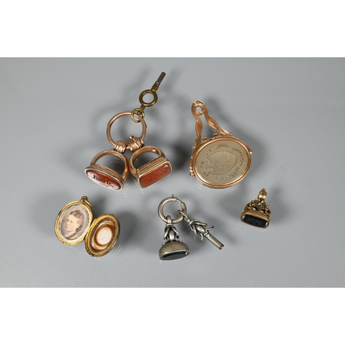 209 - Two gilt metal fob seals set cornelian intaglios with monograms, a smaller example set with hardston... 