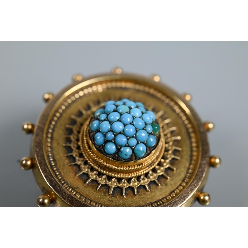 211 - A Victorian target brooch with beaded edge and rope and wirework decoration, the central boss set ov... 