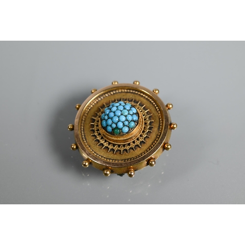 211 - A Victorian target brooch with beaded edge and rope and wirework decoration, the central boss set ov... 